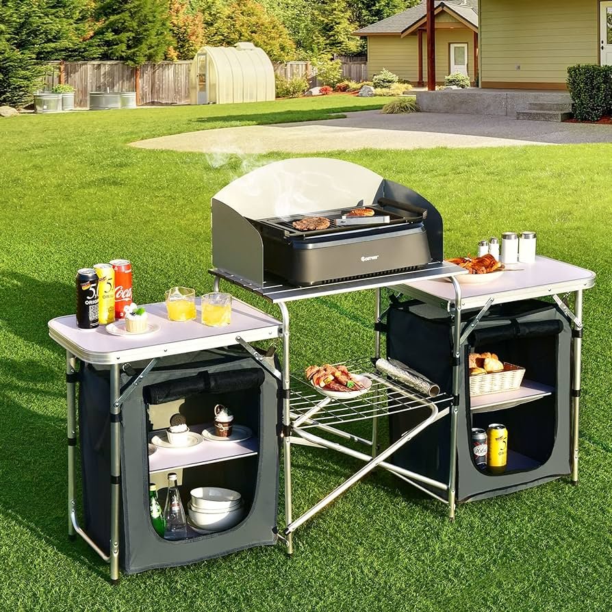 Goplus Mesa de cocina plegable para acampar con almacenamiento, mesa de cocina portátil de aluminio para exteriores con parabrisas, mesa de campamento...